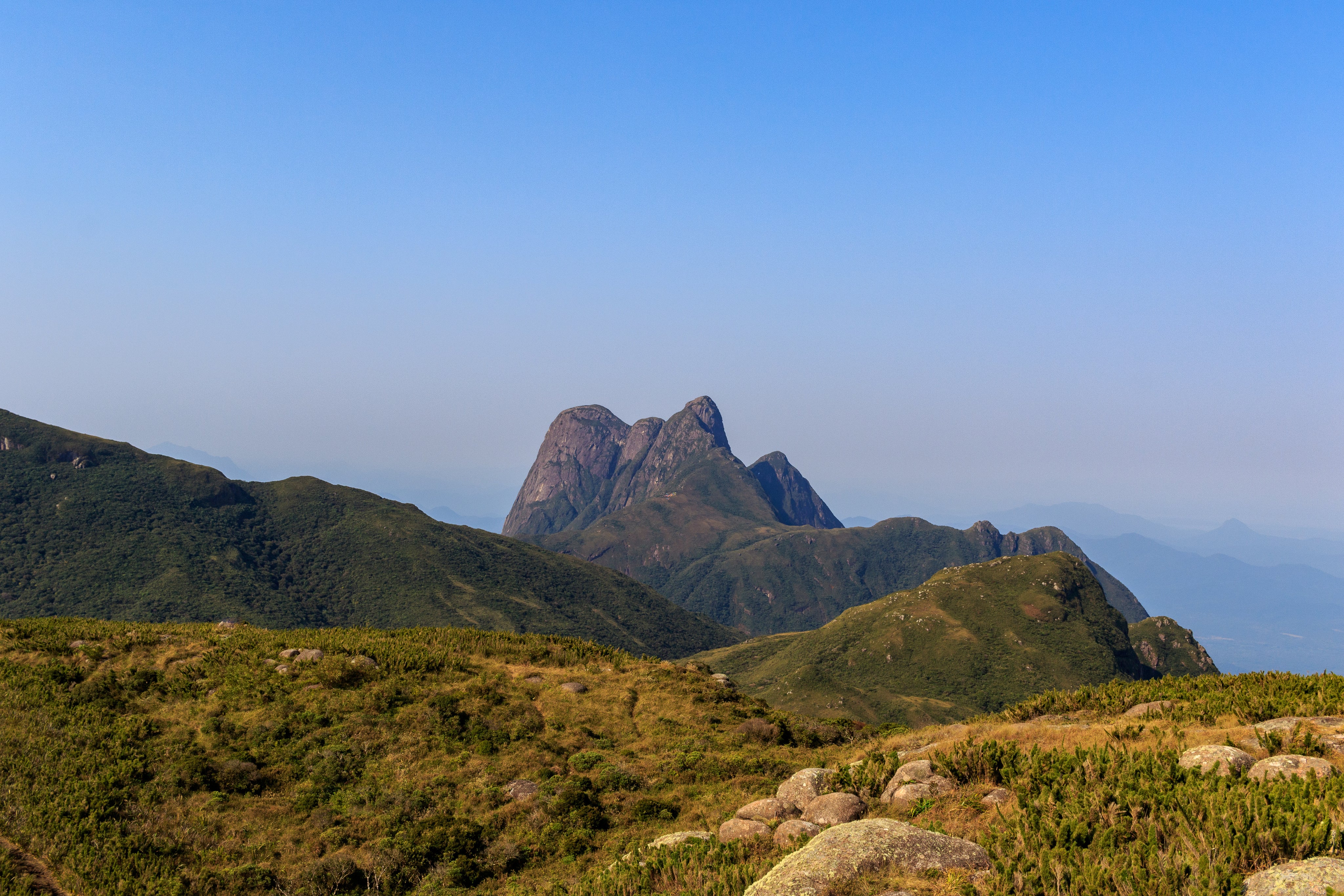 landscape-of-green-rolling-hills-and-mountain-peaks.jpg